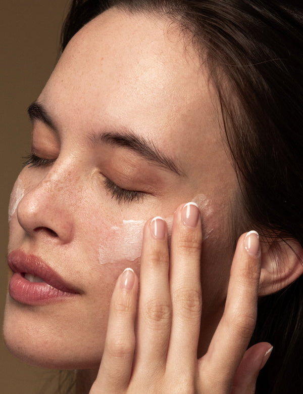 Model applying Antipodes Lime Caviar Collagen-Rich Firming Cream