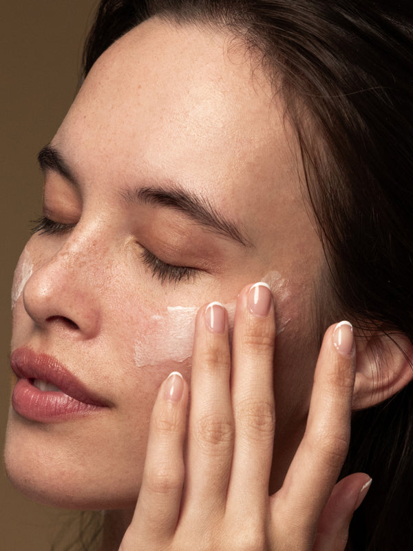 Model applying Antipodes Lime Caviar Collagen-Rich Firming Cream
