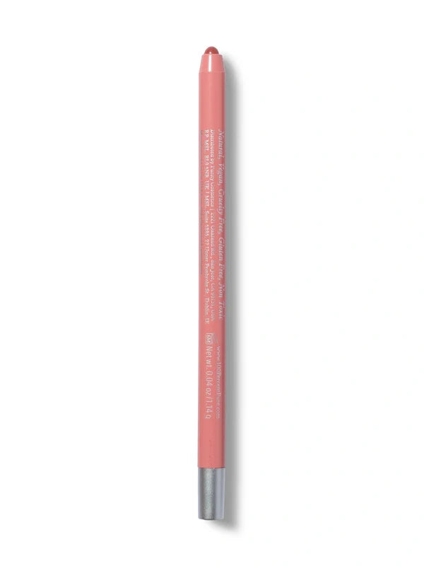 A pale pink 100% Pure lip liner stands upright with its rounded pink tip exposed. Small pale text runs down the back of the barrel, and a silver-coloured band finishes the base.