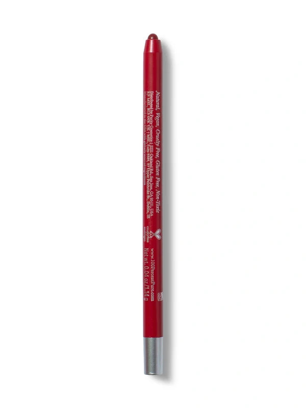 A deep red 100% Pure lip liner stands upright with its rounded red tip exposed. Small pale text runs down the back of the barrel, with a silver-coloured band at the base.