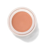 An open round pot of Toffee Long Last Concealer, viewed from above, showing smooth warm tan cream within a white rim.