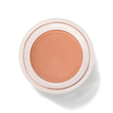 An open round pot of Toffee Long Last Concealer, viewed from above, showing smooth warm tan cream within a white rim.