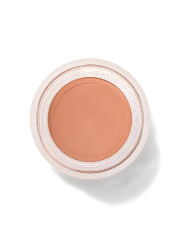 An open round pot of Toffee Long Last Concealer, viewed from above, showing smooth warm tan cream within a white rim.