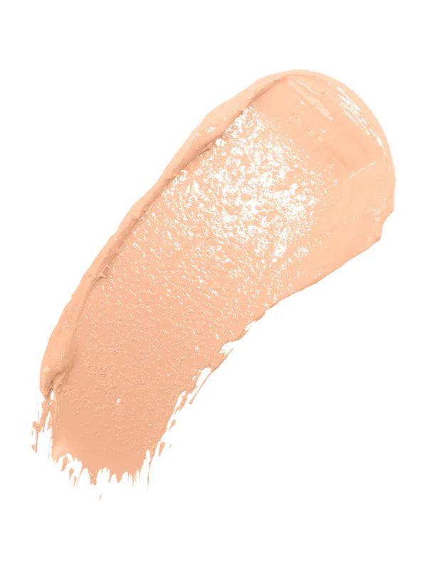 A diagonal swatch of Crème Long Last Concealer in pale peach beige, with a creamy sheen and a thick rounded end tapering into fine streaks.