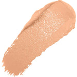 A diagonal swatch of Peach Bisque Long Last Concealer in warm peach beige, with a creamy sheen and a thick rounded end tapering into fine streaks.