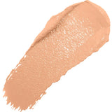 A diagonal swatch of Peach Bisque Long Last Concealer in warm peach beige, with a creamy sheen and a thick rounded end tapering into fine streaks.