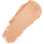 A diagonal swatch of White Peach Long Last Concealer in light peach beige, with a creamy sheen and a thick rounded end tapering into fine streaks.