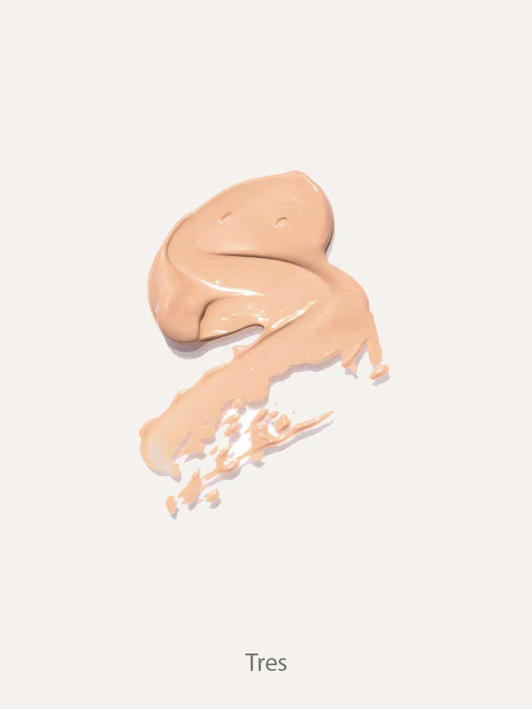 A smooth swatch of Ere Perez Lychee Crème Corrector 10ml in beige, spread on a light background and ideal for brightening dark circles, with "Tres" written underneath.