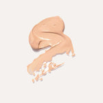 A smooth swatch of Ere Perez Lychee Crème Corrector 10ml in beige, spread on a light background and ideal for brightening dark circles, with "Tres" written underneath.