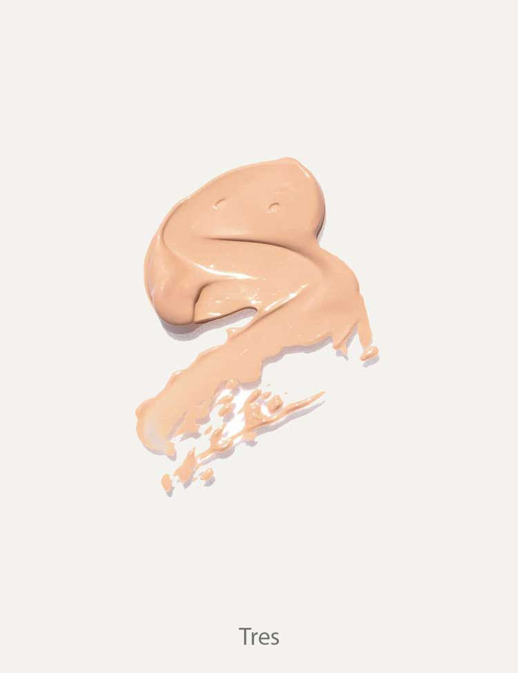 A smooth swatch of Ere Perez Lychee Crème Corrector 10ml in beige, spread on a light background and ideal for brightening dark circles, with "Tres" written underneath.