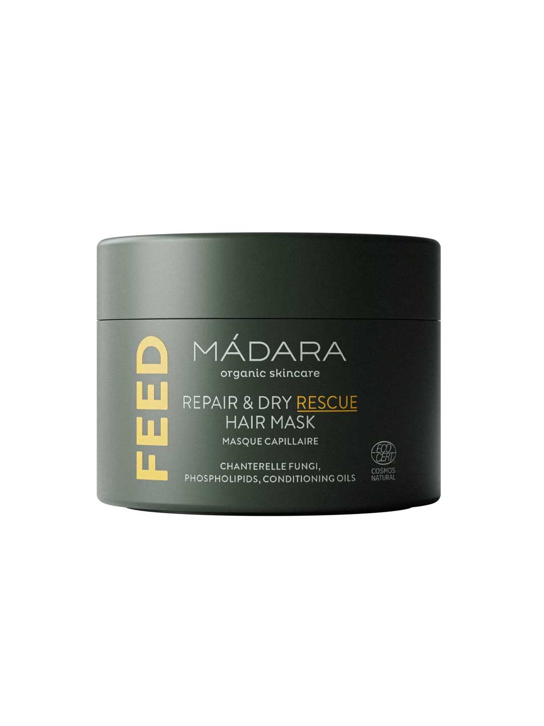 A dark green 180ml jar of Madara Feed Repair Dry Rescue Hair Mask, featuring white and yellow text and highlighting its intensive conditioning ingredients on the label.