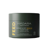 A dark green 180ml jar of Madara Feed Repair Dry Rescue Hair Mask, featuring white and yellow text and highlighting its intensive conditioning ingredients on the label.