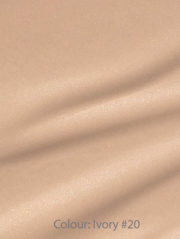 Madara Skin Equal Soft Glow Foundation SPF15 30ml in shade Ivory #20 offers a smooth, lightly shimmery finish in light beige with subtle horizontal texture, evoking the look of dewy, radiant skin.