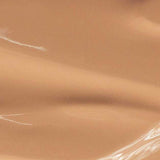 A smooth, glossy surface in a warm golden sand shade—like a dewy finish foundation. Text at the bottom reads: Madara Skin Equal Soft Glow Foundation SPF15 30ml, Colour: Golden Sand #50.
