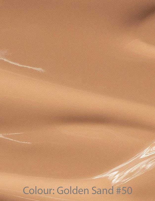 A smooth, glossy surface in a warm golden sand shade—like a dewy finish foundation. Text at the bottom reads: Madara Skin Equal Soft Glow Foundation SPF15 30ml, Colour: Golden Sand #50.