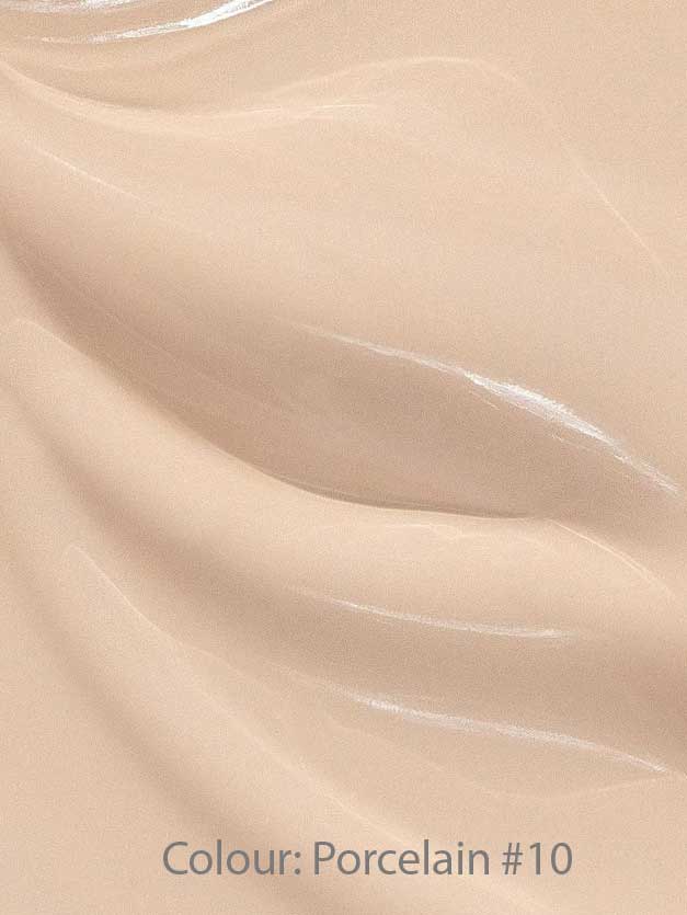 Close-up of Madara Skin Equal Soft Glow Foundation SPF15 30ml in Porcelain #10—a smooth, creamy light beige mineral formula with subtle swirls and a glossy, dewy finish.