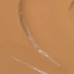 Close-up of Madara Skin Equal Soft Glow Foundation SPF15 30ml in a creamy warm olive shade with visible brush strokes. Text at the bottom reads: Colour: Olive #60.