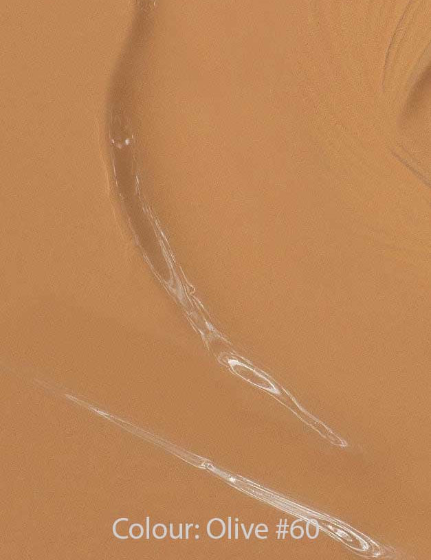 Close-up of Madara Skin Equal Soft Glow Foundation SPF15 30ml in a creamy warm olive shade with visible brush strokes. Text at the bottom reads: Colour: Olive #60.