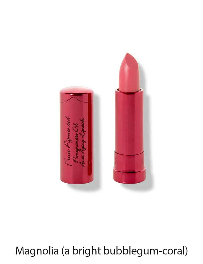 A vegan, moisturising pink-coral lipstick—100% Pure Pomegranate Oil Moisturising Lipstick 4.5g—in a shiny metallic pink tube with black cursive writing. Shown upright, cap off. Below: Magnolia (a bright bubblegum-coral).