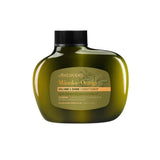 An olive green bottle of Antipodes Manuka + Orange Volume & Shine Conditioner 340ml with a black cap, shown on a white background. The label emphasizes its silicone-free formula, natural ingredients, and volumizing benefits.