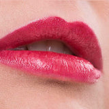 Close-up of lips wearing Benecos Natural Lipsticks 4.5g in bright pink, slightly parted to show teeth. The background is soft pink, with "Marry Me" written below the image.