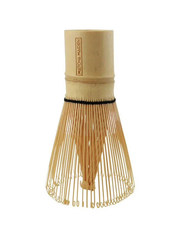 The Matcha Maiden Bamboo Matcha Whisk features fine curved tines and a cylindrical handle, standing upright on a white background.