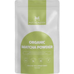 A white and green resealable pouch labeled Matcha Maiden Matcha Green Tea Powder 100% Pure Stone Ground 70g features icons and text highlighting its pure Japanese matcha quality, with "For a cup you'll never forget" at the bottom.