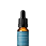 Miniature Antipodes Maya Hyaluronic Hydration Serum in an amber glass bottle with a turquoise label and a black dropper with a ribbed collar.