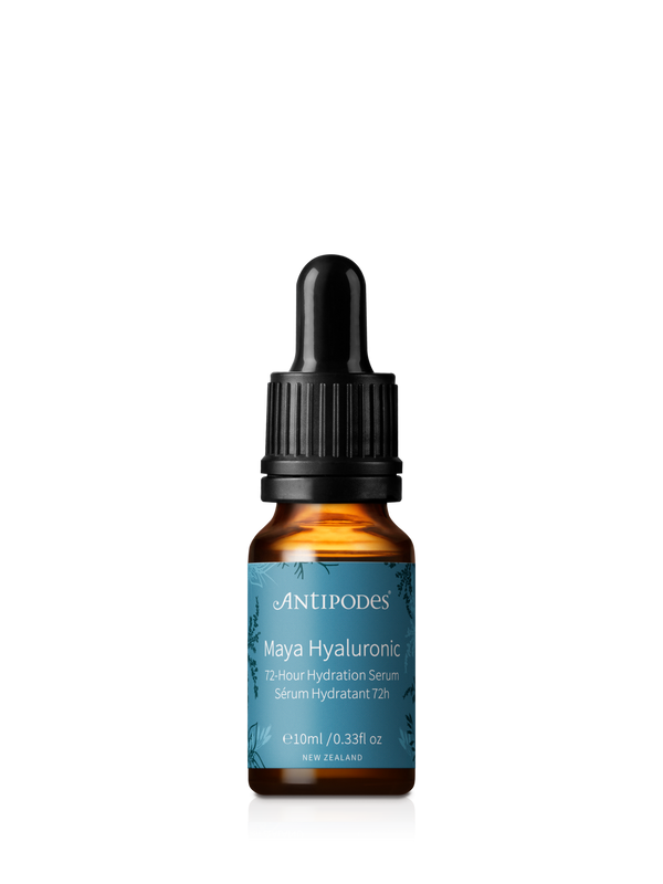 Miniature Antipodes Maya Hyaluronic Hydration Serum in an amber glass bottle with a turquoise label and a black dropper with a ribbed collar.
