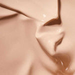 Close-up of a smooth, creamy beige liquid with a glossy texture, likely Hyaluronic Anti-Pollution CC Cream SPF15 40ml; 'Colour: Medium' appears at the bottom.
