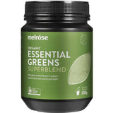 A green plastic jar labeled Melrose Certified Organic Essential Greens Powder 200g, featuring a scoop of greens powder and text highlighting detoxification and gut health benefits. The jar contains 200g of superfood blend powder.