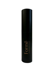 A black cylindrical bottle of Metamorphosis Formë Aromatherapeutic Perfume 10ml stands upright on a white background, featuring gold lettering and offering a natural, alcohol-free fragrance that supports emotional wellbeing.