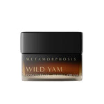A small brown jar with a black lid labeled Metamorphosis Wild Yam Concentrate Dermal Cream 50ml, shown on a white background, offers natural menopausal support and promotes hormonal balance.