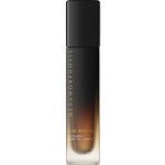 A sleek gradient glass bottle with a black cap, labeled Metamorphosis The Ritual Ceramide Body Oil 100ml by Metamorphosis, is shown on a white background—perfect for hydrating skin in menopause routines.