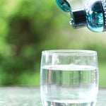 Elektra Magnesium Mineral Drops poured into water