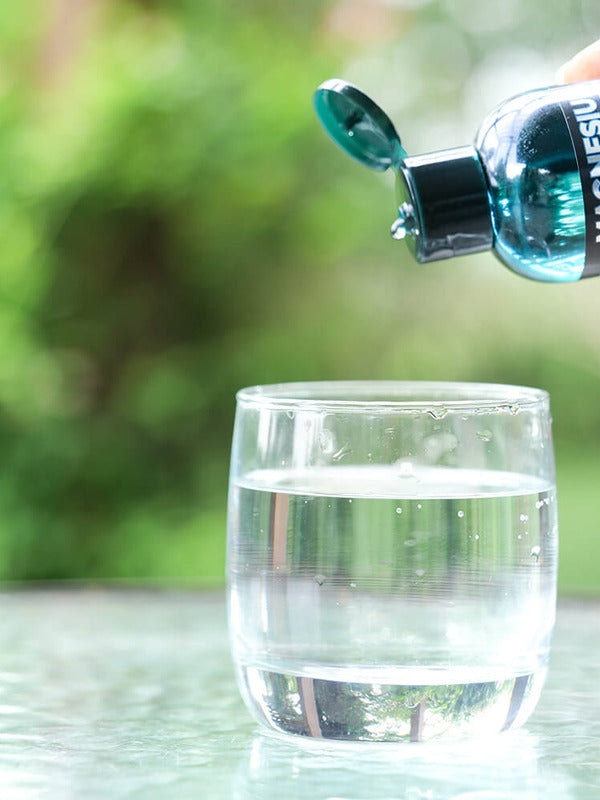 Elektra Magnesium Mineral Drops poured into water