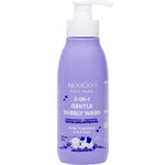 A 500ml bottle of MooGoo 2-in-1 Mini Moo Bubbly Wash with pump, gentle and natural for sensitive skin, in purple packaging with white and blue text and a cartoon cow at the bottom.