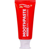 A red MooGoo Kids Moothpaste Watermelon Sherbet 50g tube stands upright with a white cap, featuring a watermelon icon. The packaging highlights that it's natural and fluoride free.
