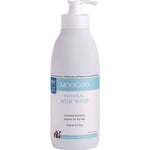 A white pump bottle of MooGoo Milk Wash 500ml, a creamy hydrating cleanser for dry skin. Its label states it's soap and SLS free, making it an ideal natural body wash for sensitive skin.