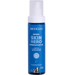 Blue bottle of Moogoo Skin Hero Hydrating Body Oil on a white background