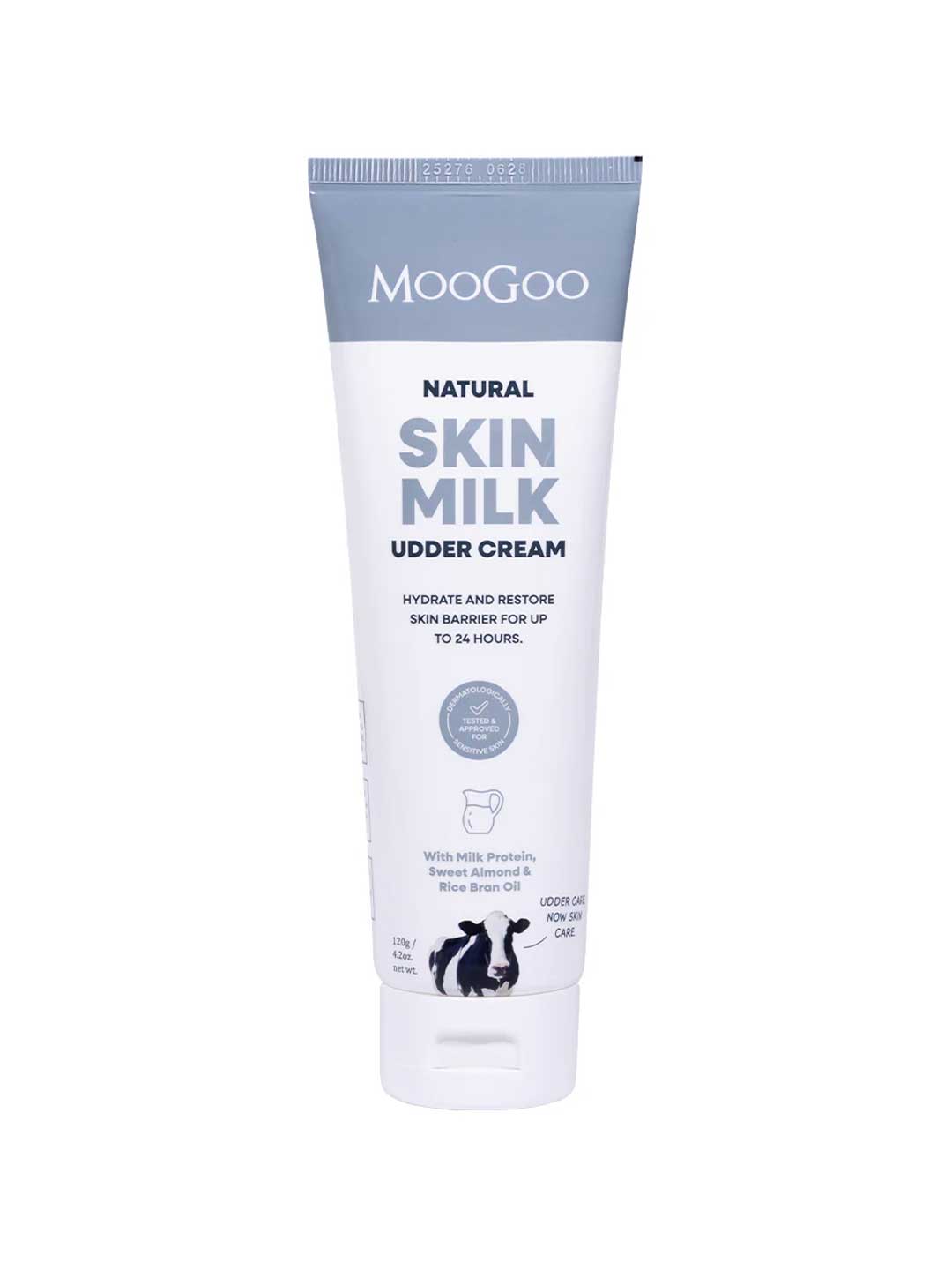 A tube of MooGoo Skin Milk Udder Cream, a sensitive skin moisturiser with blue and white packaging, hydrating and restoring benefits listed on the label, and a cow illustration near the base.