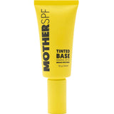 A yellow tube of MotherSPF Tinted Base SPF50 Face Sunscreen 50g stands upright, with the brand name and product details in black.