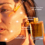 Woman applying Mud Organics Sea Buckthorn Serum in warm sunlight