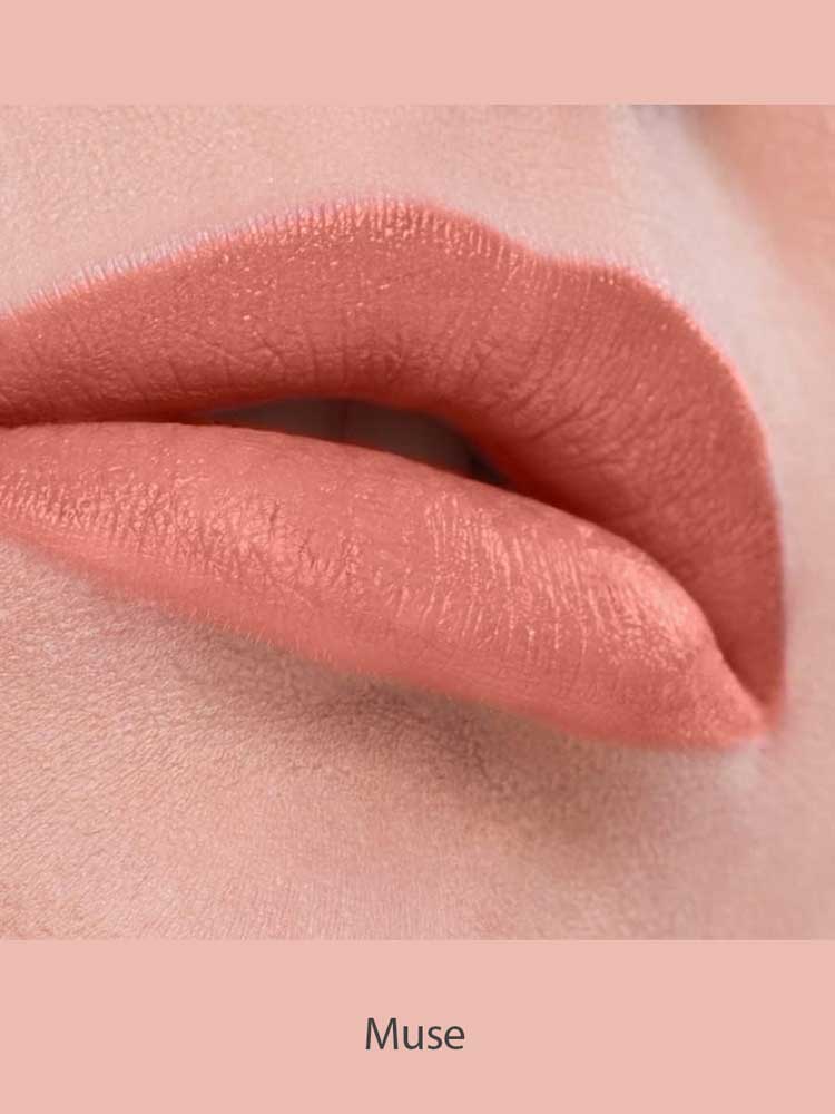 Close-up of lips wearing Benecos MAT Lipsticks 4.5 in mauve-pink, featuring a smooth, even matte finish. "Muse" appears below on a matching pink background.