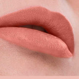 Close-up of lips wearing Benecos MAT Lipsticks 4.5 in mauve-pink, featuring a smooth, even matte finish. "Muse" appears below on a matching pink background.