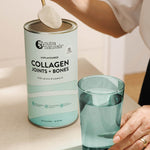 Spooning Nutra Naturals Collagen Joints and Bones into a glass