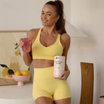 Woman holding Nutra Naturals Protein Water Berry Bliss