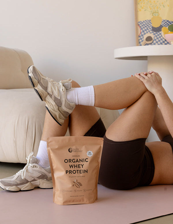 Woman stretching beside Nutra Naturals Organic Whey Protein Chocolate