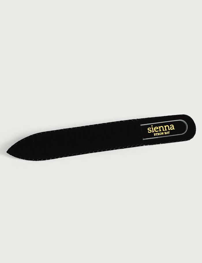 A sturdy black case for the Sienna Byron Bay Glass Nail File showcases the brand’s gold logo on a light background.