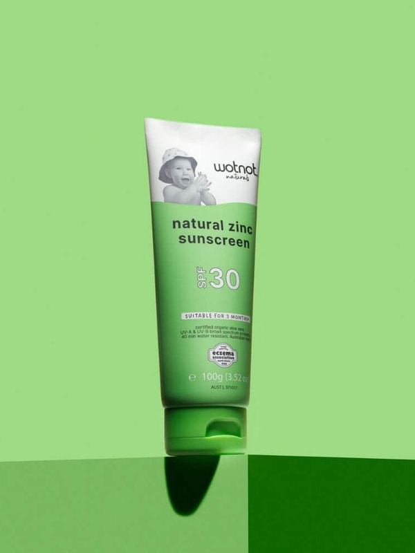 Wotnot Natural Baby Sunscreen SPF 30 tube on green background
